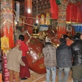 The local community helps erecting the statue of Buddha Shakyamuni.