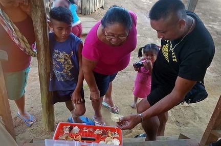 Villagers checking out mushroom collection